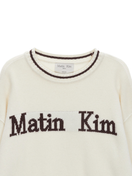 SLEEVE LETTERING KNIT PULLOVER IN IVORY