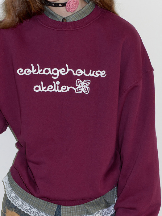 Atelier handle embroidery sweatshirt. Wine