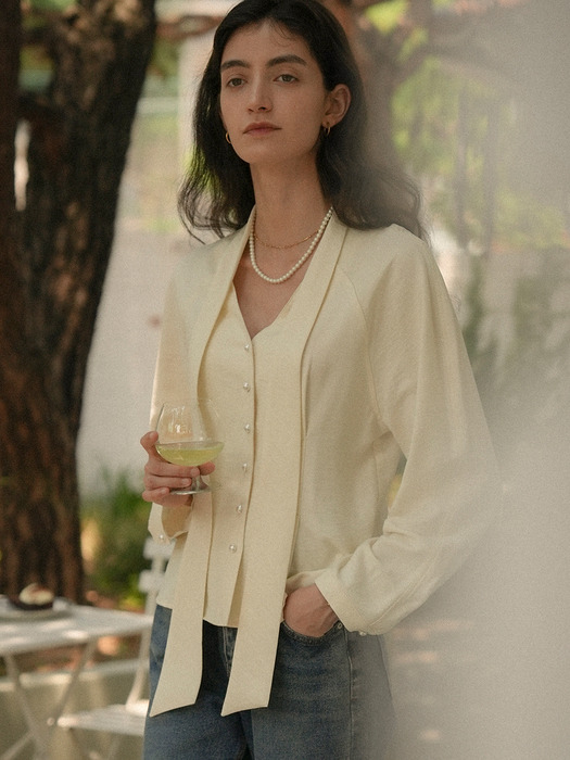 Tied collar pearl button flare blouse_Butter