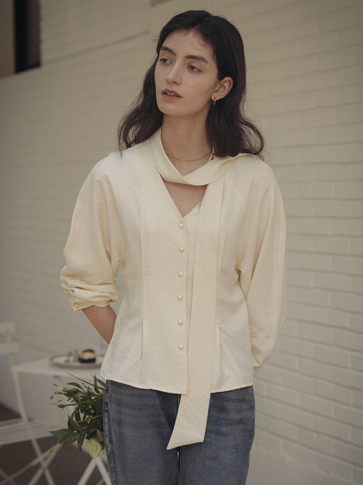 Tied collar pearl button flare blouse_Butter