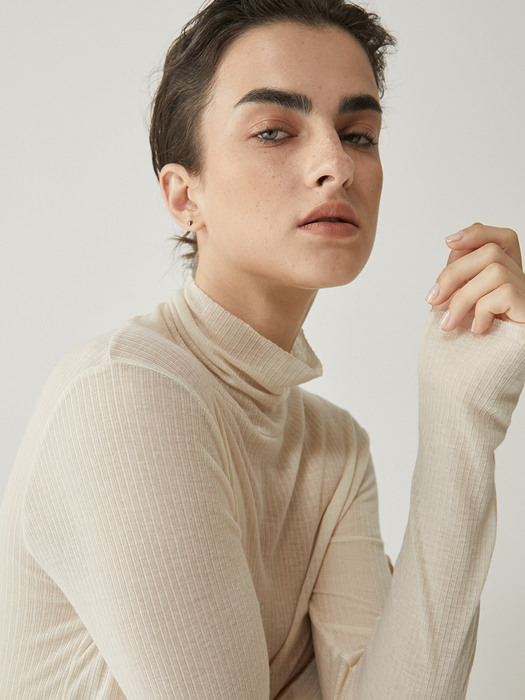 See through wool turtleneck in Cream