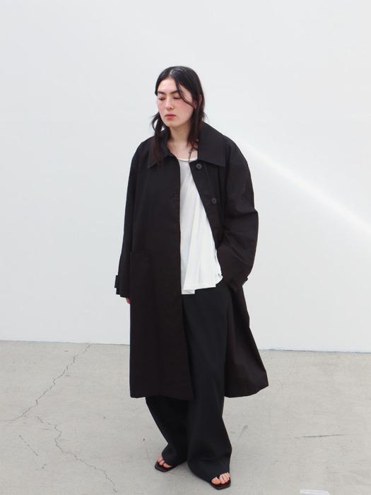 Black oil coating trench coat