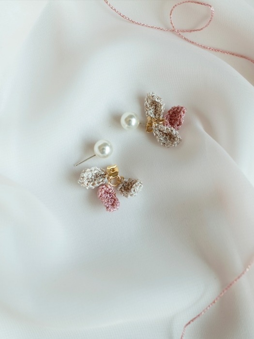 Flowering petals and pearl earring