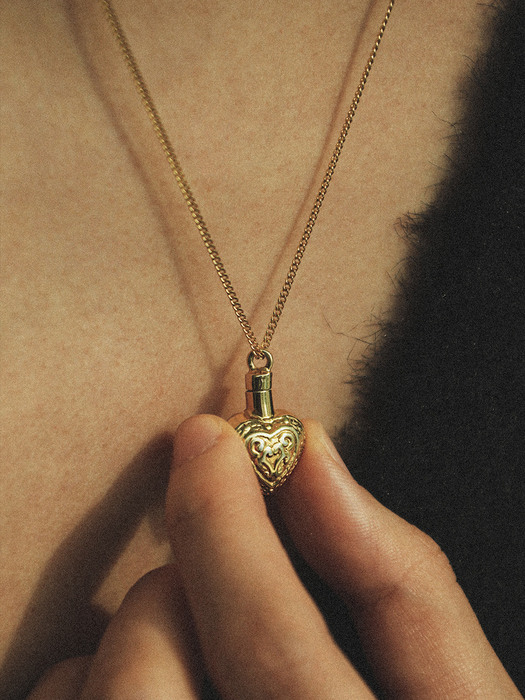 Antique heart bottle necklace