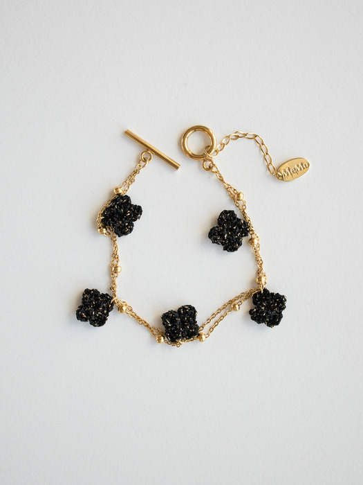 Knitted black clover with surgical bracelet