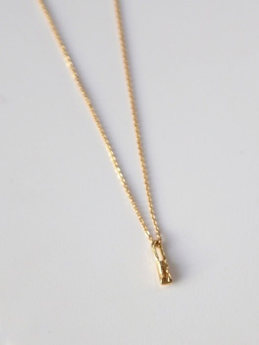 Tiny bone necklace - gold
