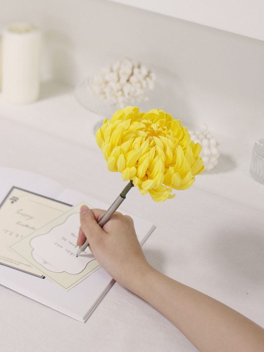 yellow chrysanthemum flower pen