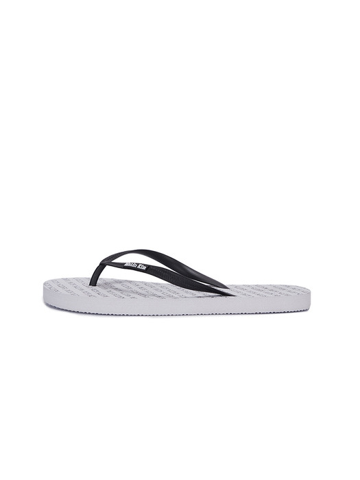 MATIN KIM LOGO WHOLE PRINT FLIP FLOP IN WHITE