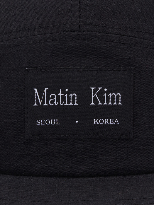 Matin Kim마뗑킴]LOGO LABEL SOLID CAMP CAP IN BLACK