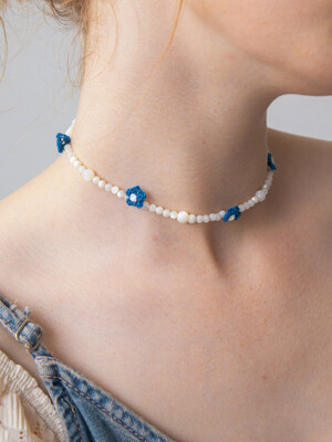 Blue flower with mother-of-pearl necklace